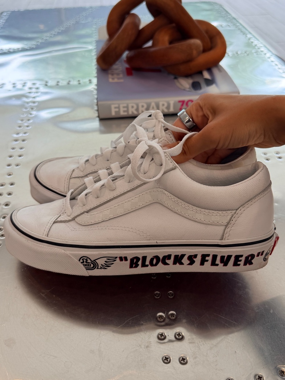 Vans White Low Top Sneakers with Black Graphic Sole